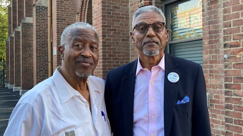 Chester Deanes, left, and Ben Phillips hold a photo of the former Pruitt-Igoe housing...
